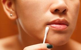 woman-damping-cotton-swab.jpg